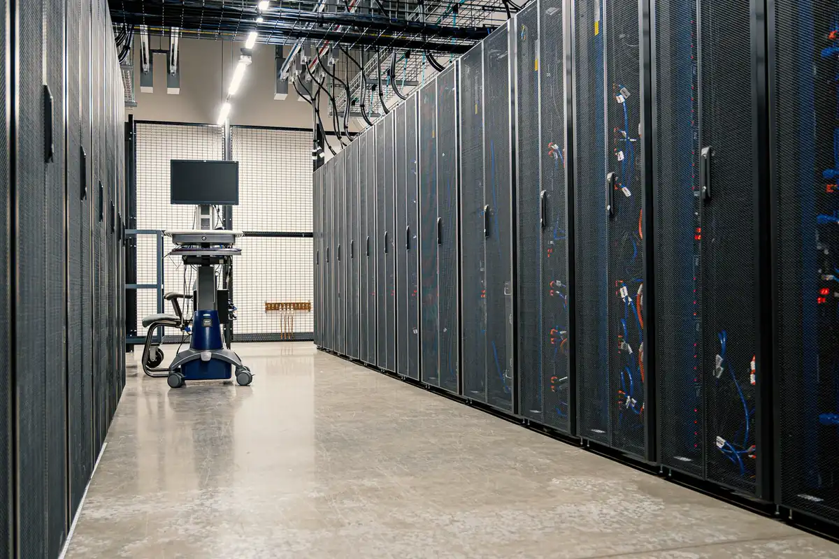 Long aisle of locked server cabinets in a data center