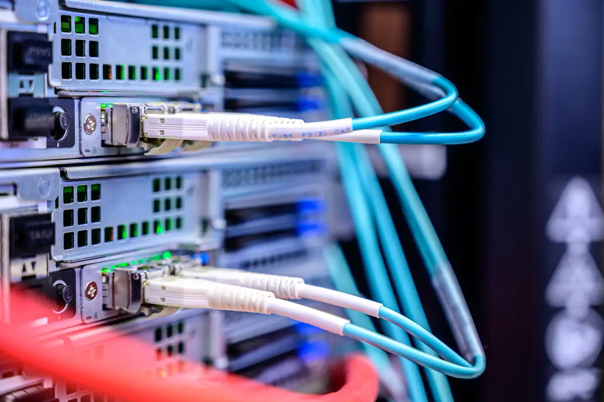 Two fiber links plugged into a switch, both showing link lights